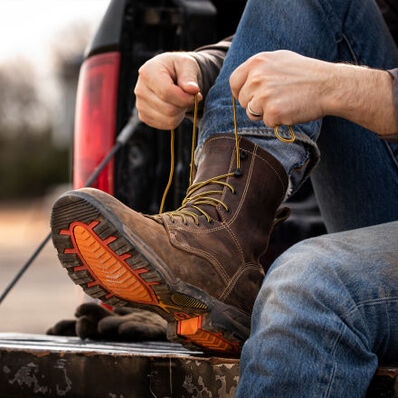 Worker lacing up Durango Maverick XP steel toe waterproof work boots
